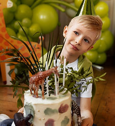 boy celebrating his birthday green background